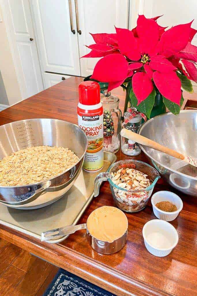 Ingredients to make homemade vanilla almond granola on the island in the kitchen