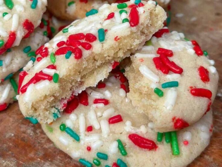 Christmas sprinkle sugar cookies on a plate.