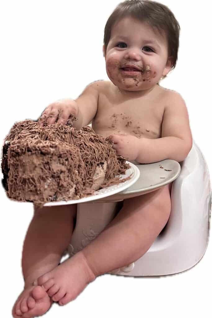Callum's first birthday, where he is eating his bear smash cake.