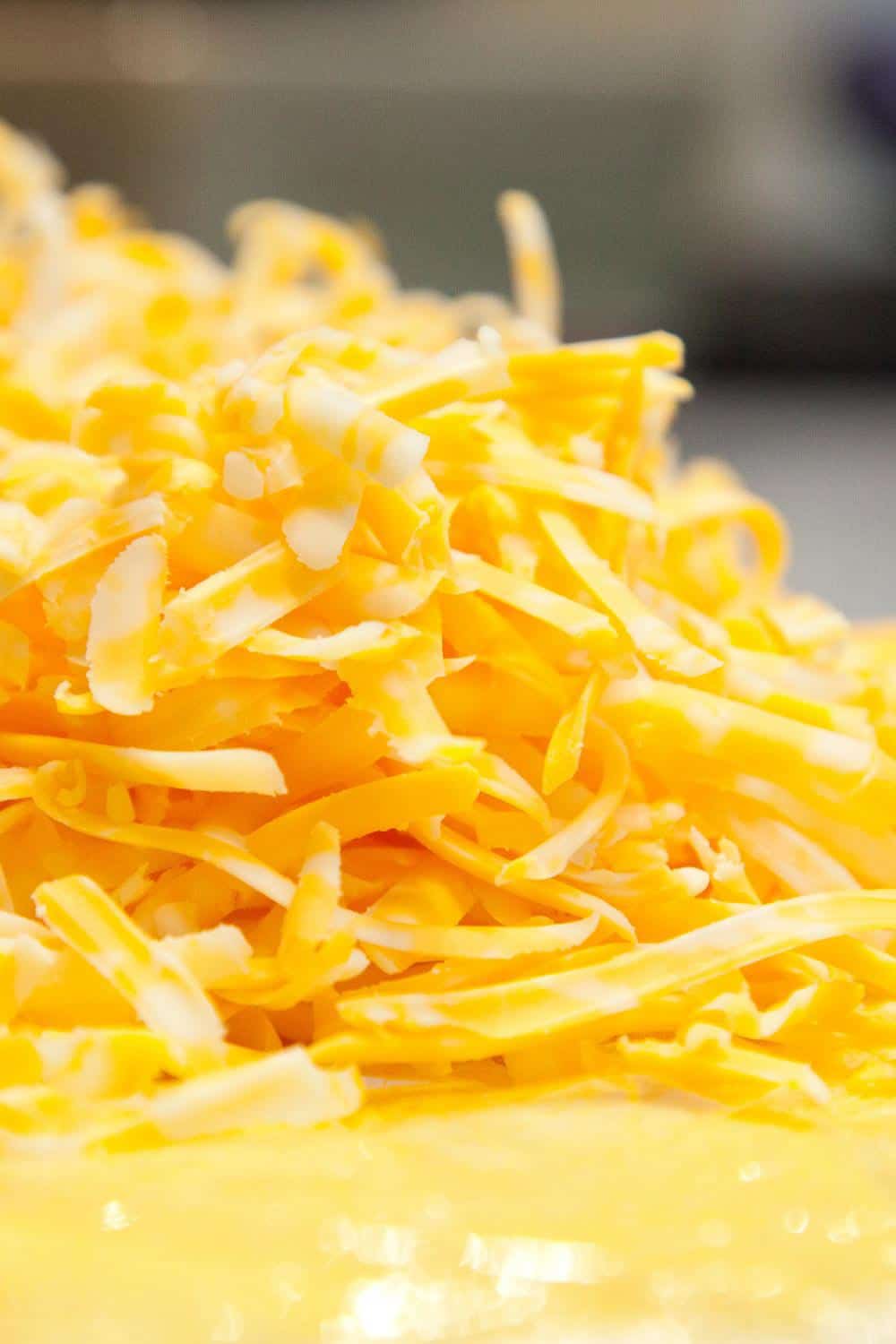 35 of the Best Nacho Toppings List-shredded cheddar cheese