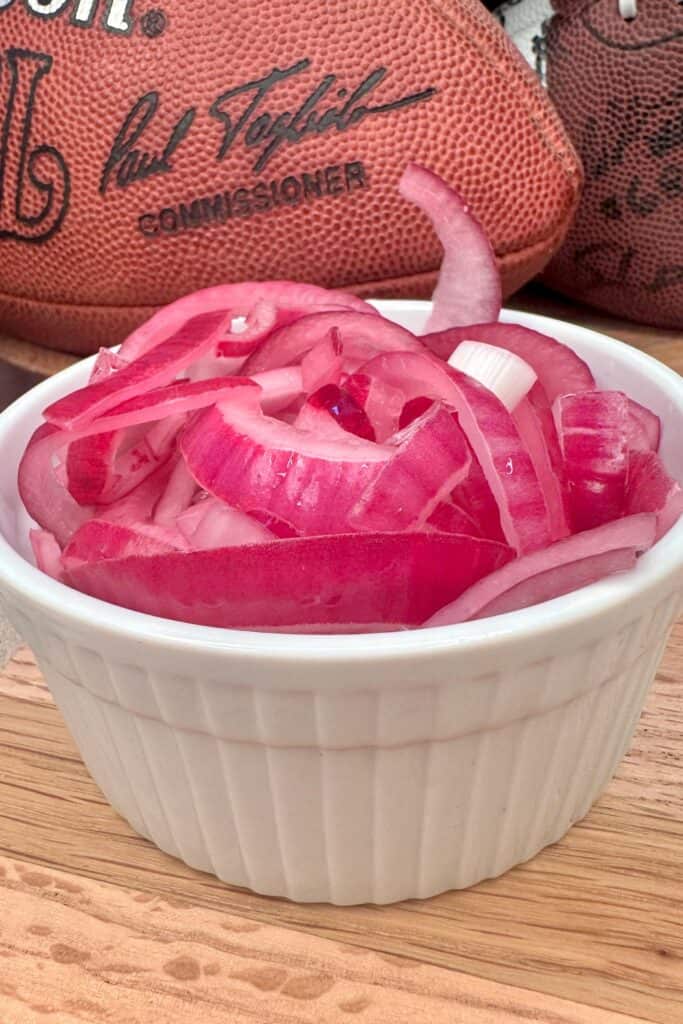 Bowl of pickled red onions to use as nacho toppings.