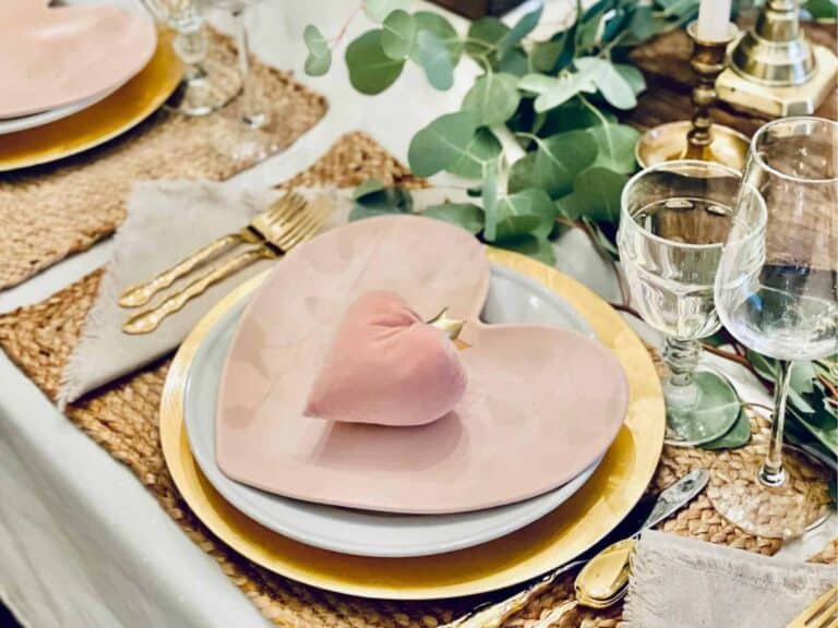 Tablescape for Valentine's Day set with soft pinks and golds.