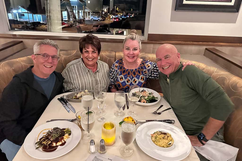 two couples eating dinner in Hawaii 