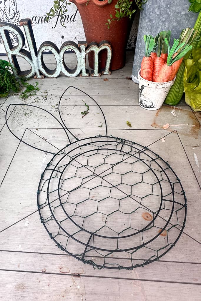 Dollar Tree Easter rabbit wire wreath frame with chicken wire behind the face.