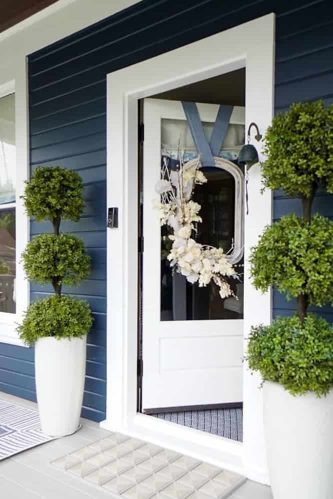 Green topiaries on the front porch 