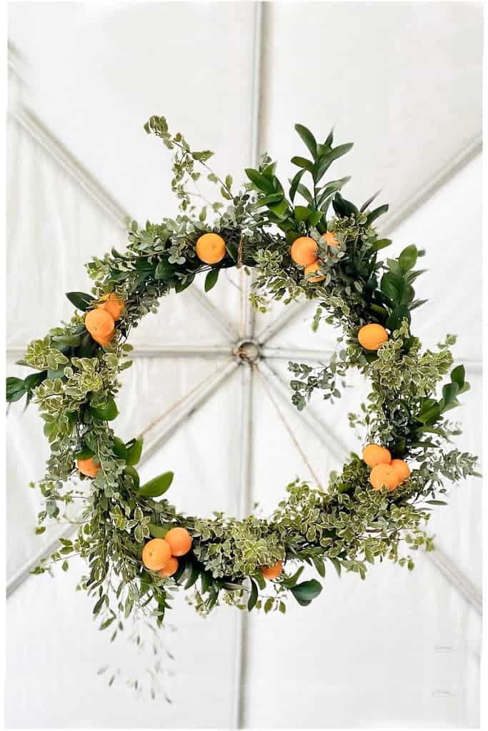 Little Cutie Wreath hanging from a tent for a baby shower.