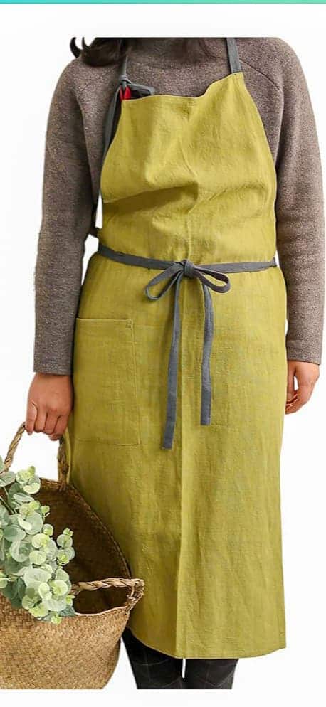 Garden apron on a woman. The perfect apron for embroidery.
