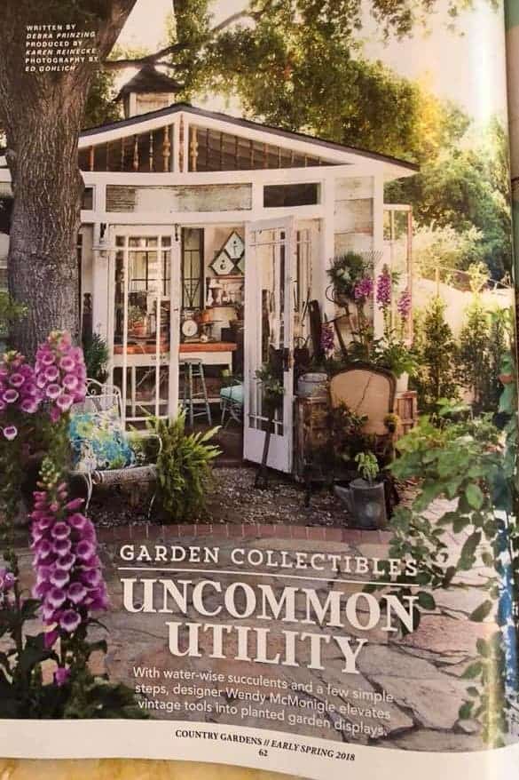 Cover of Better Homes and Garden- Country Gardens- a shed with a succulent chair and succulent planted shovels.