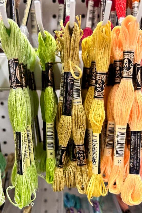 Embroidery thread in greens and yellows.