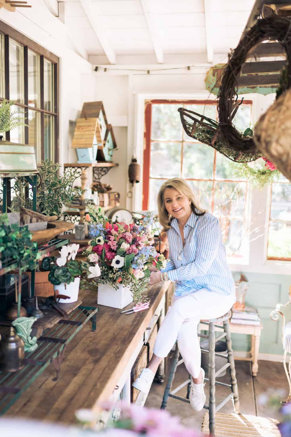 Wendy in the she shed making a floral arrangement