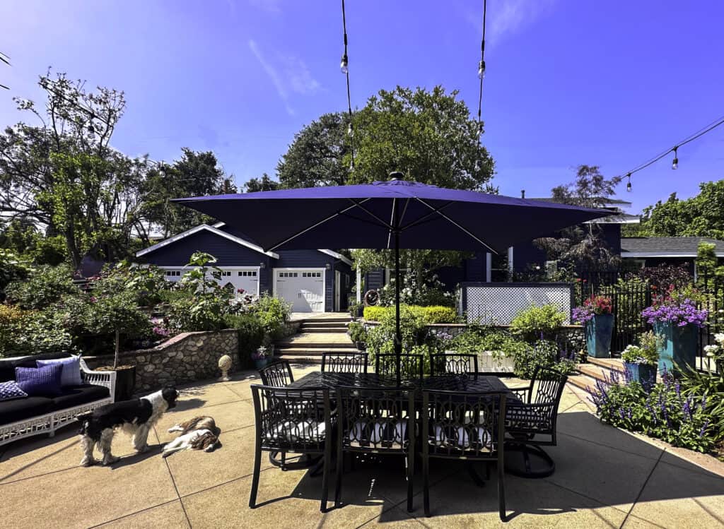 California backyard living- A beautiful backyard with tables and chairs, areas to relax and more.