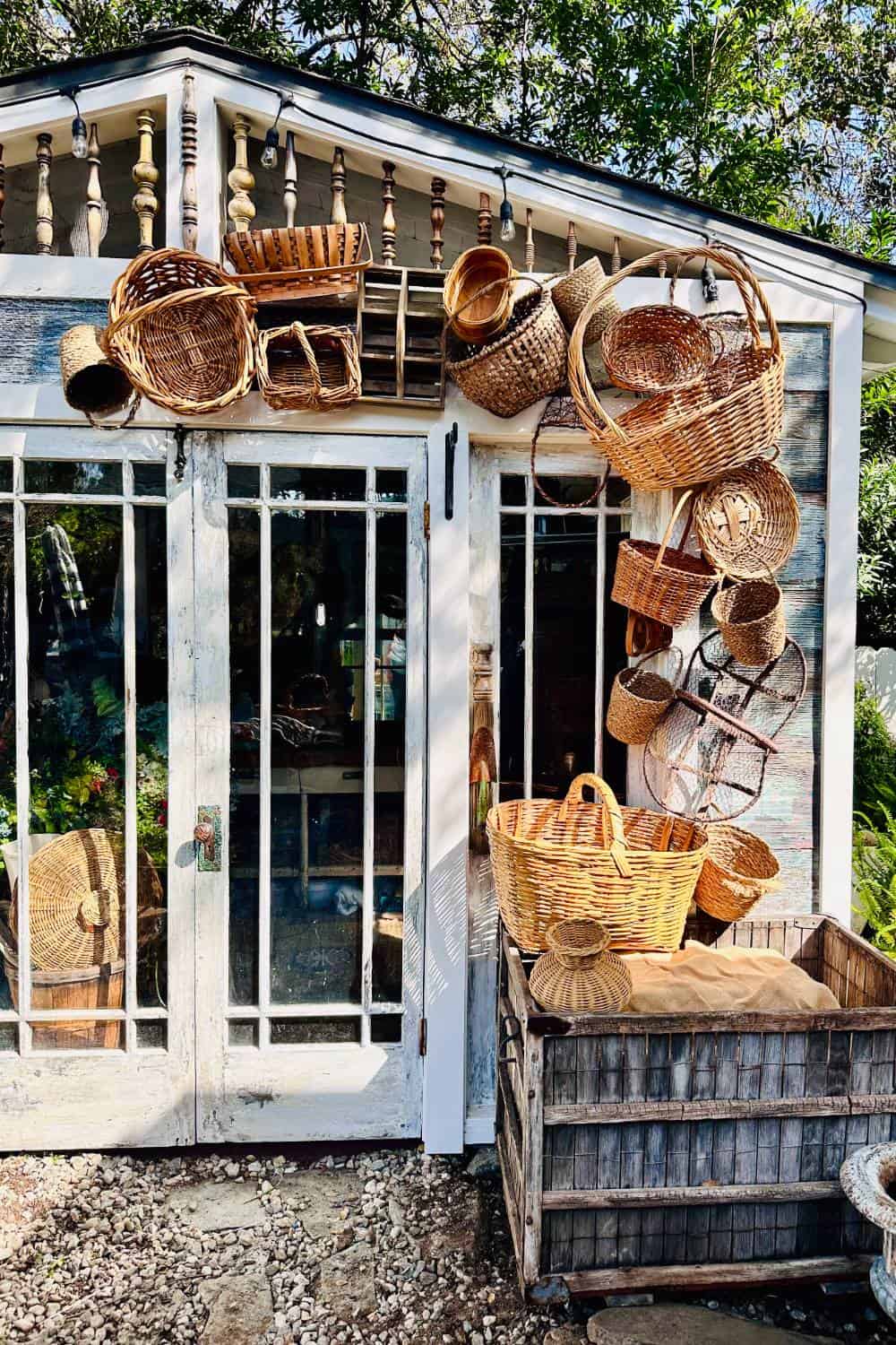 Arch decor surrounding the She Shed entrance made from thrifted baskets attached to chicken wire