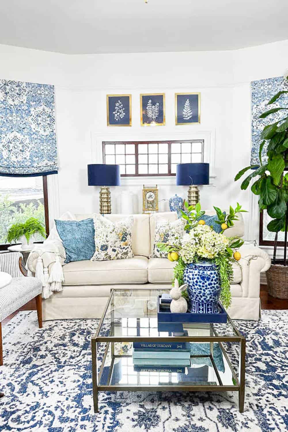 Living room with spring decor, throw pillows, plants, etc. 