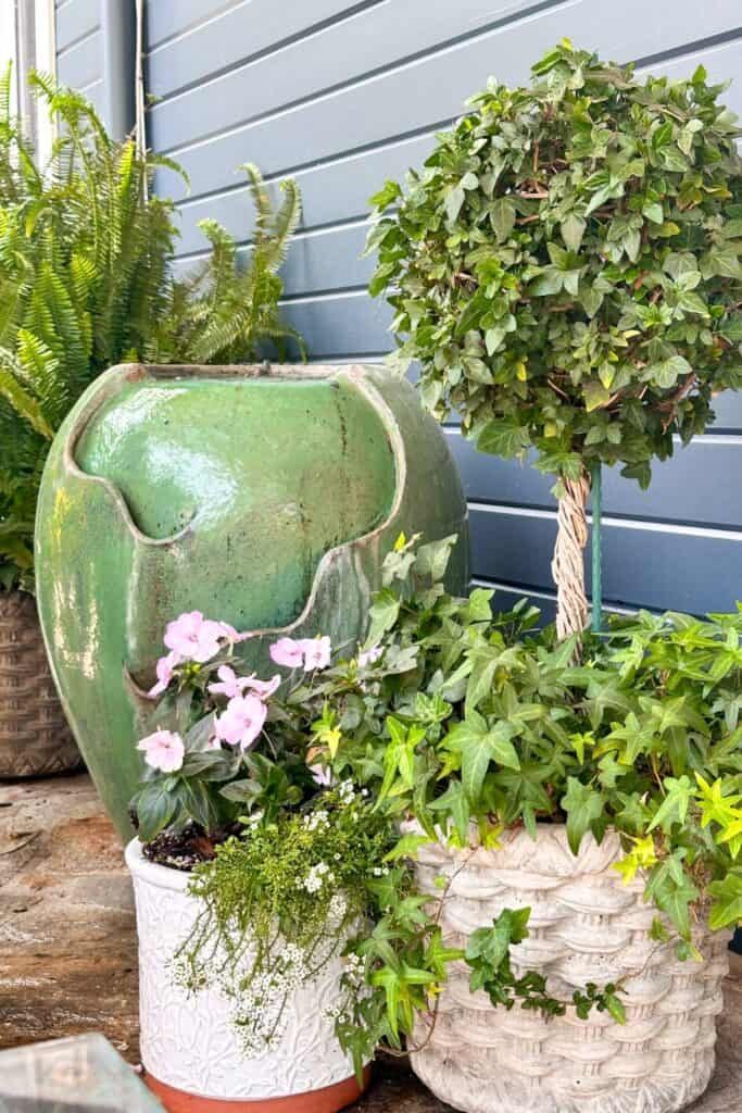 Water fountain in a pot sitting on the patio