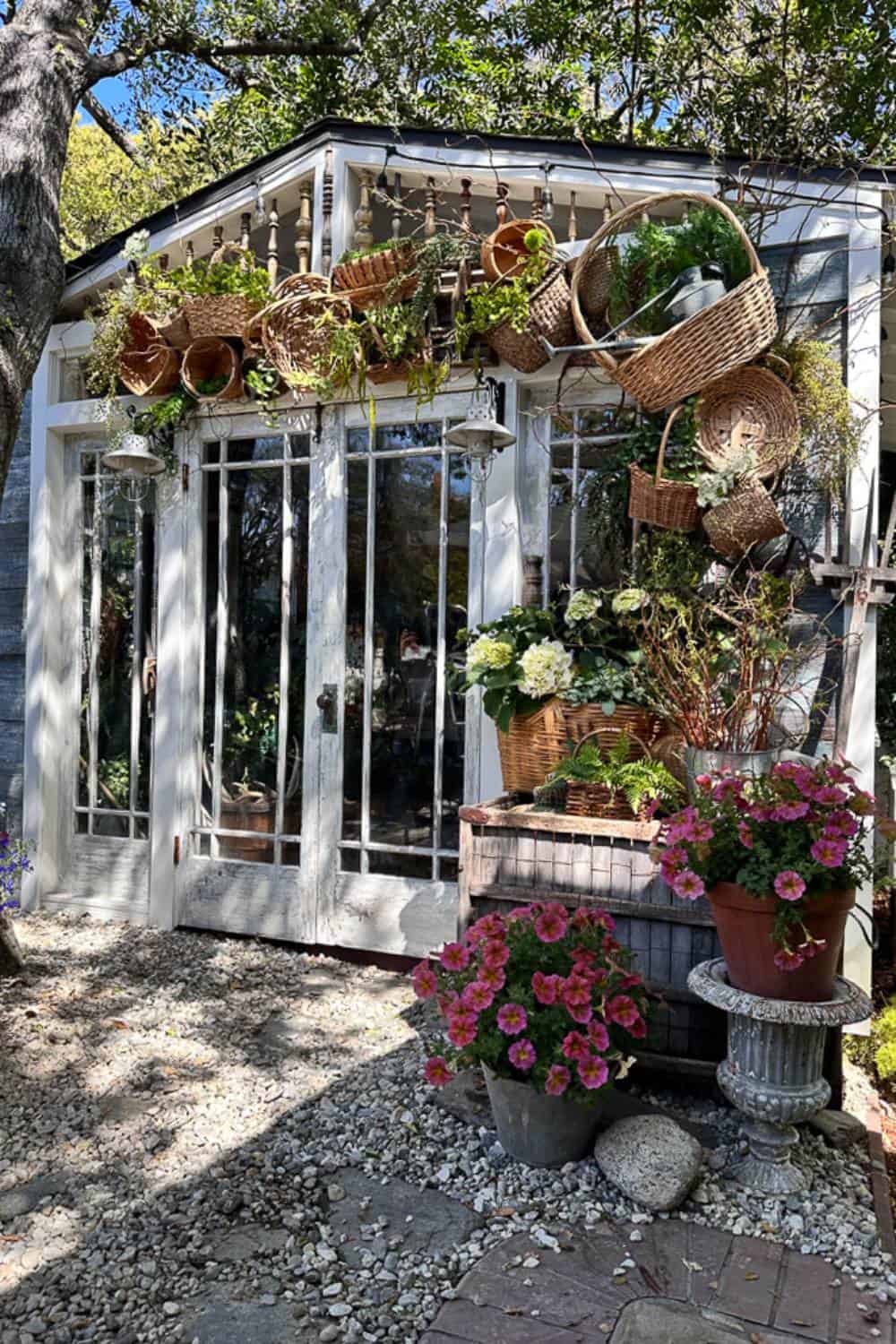 Side view of She Shed decorated with a basket arch to create unique garden decor for summer