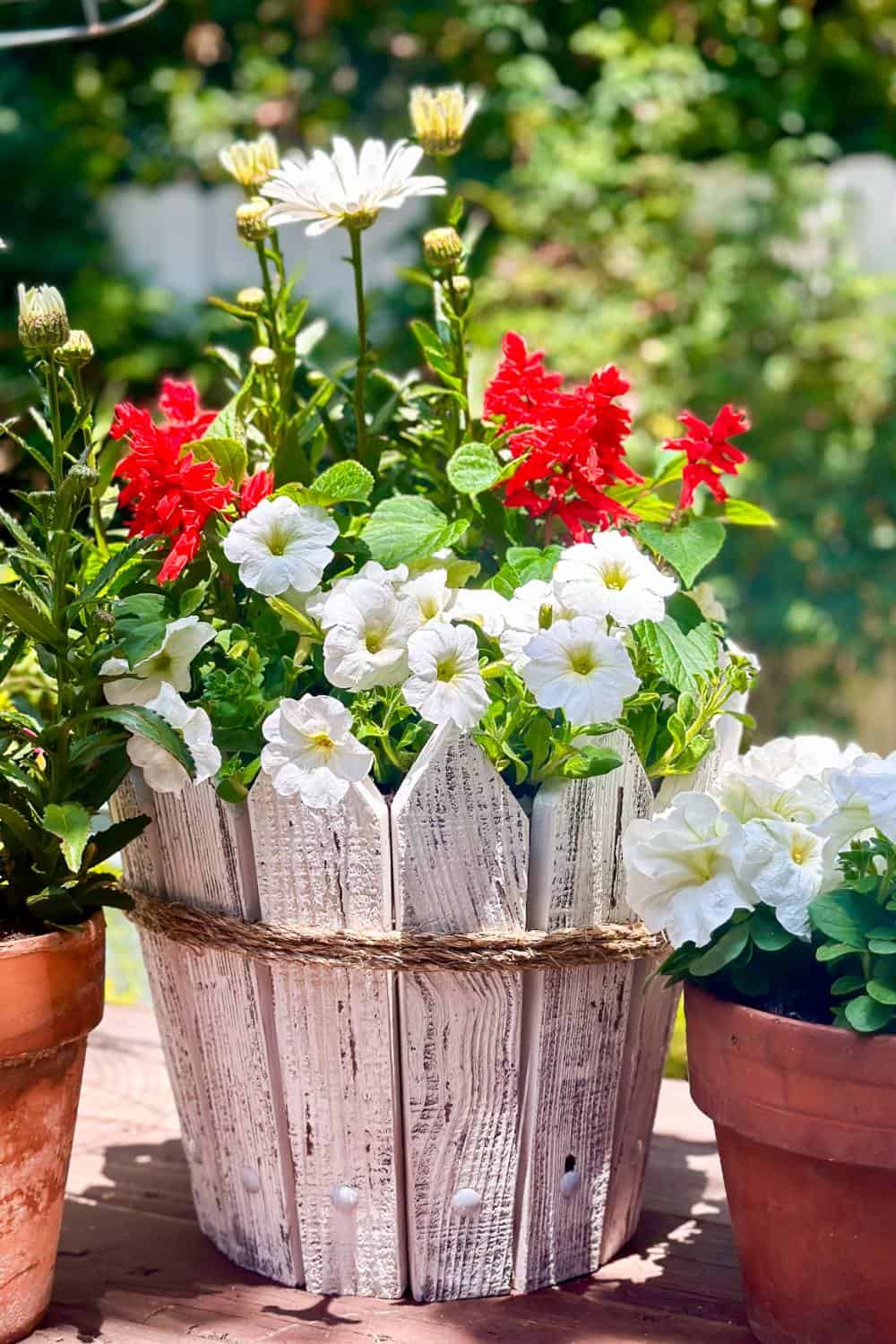 pickets attached to a flower pot and planted 