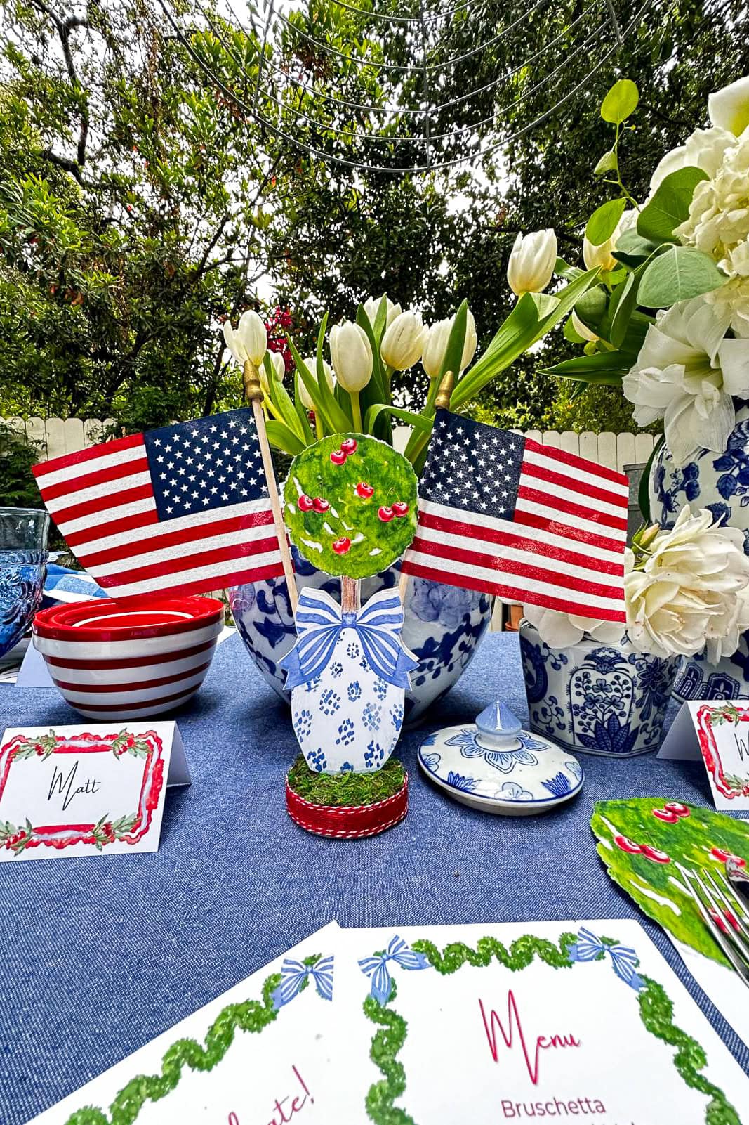 Decorating with American Flags to create a patriotic red, white and blue centerpiece with flowers