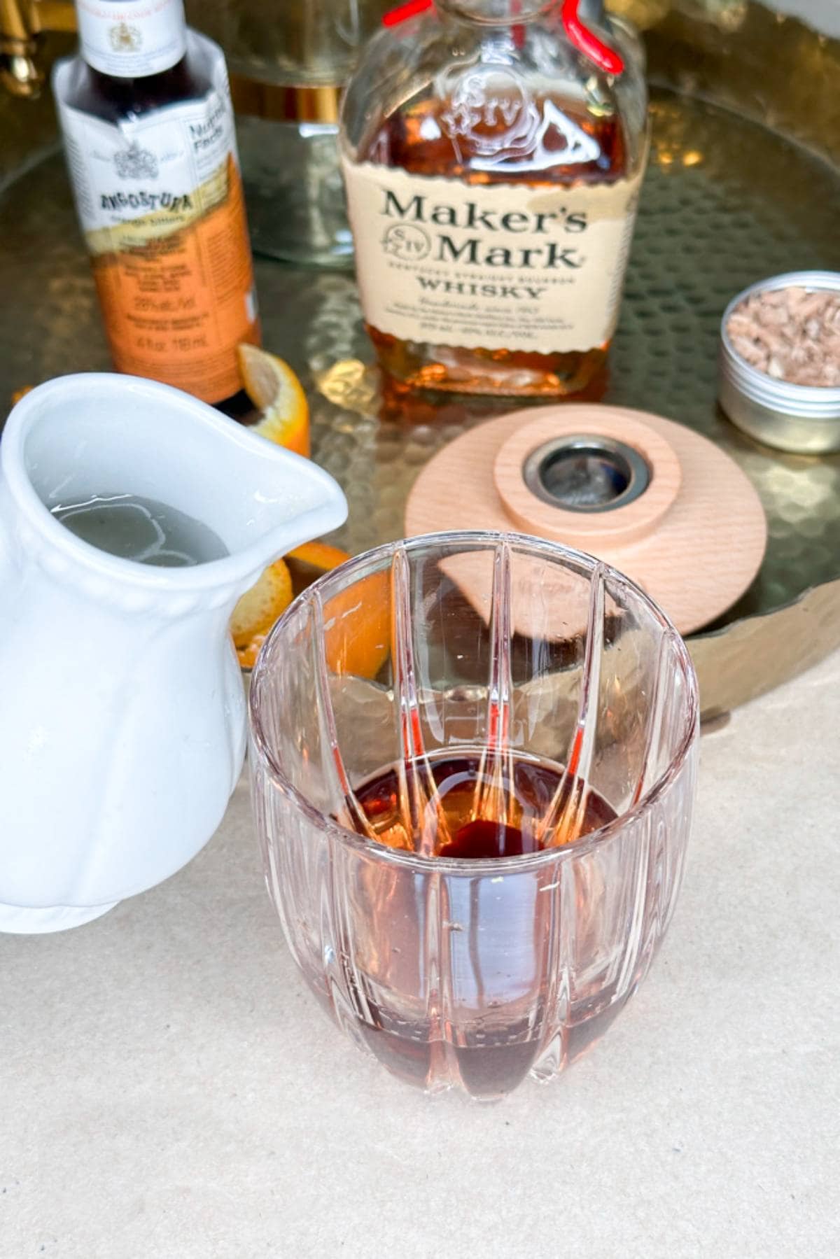 I am pouring Simple Syrup to an old fashioned cocktail.