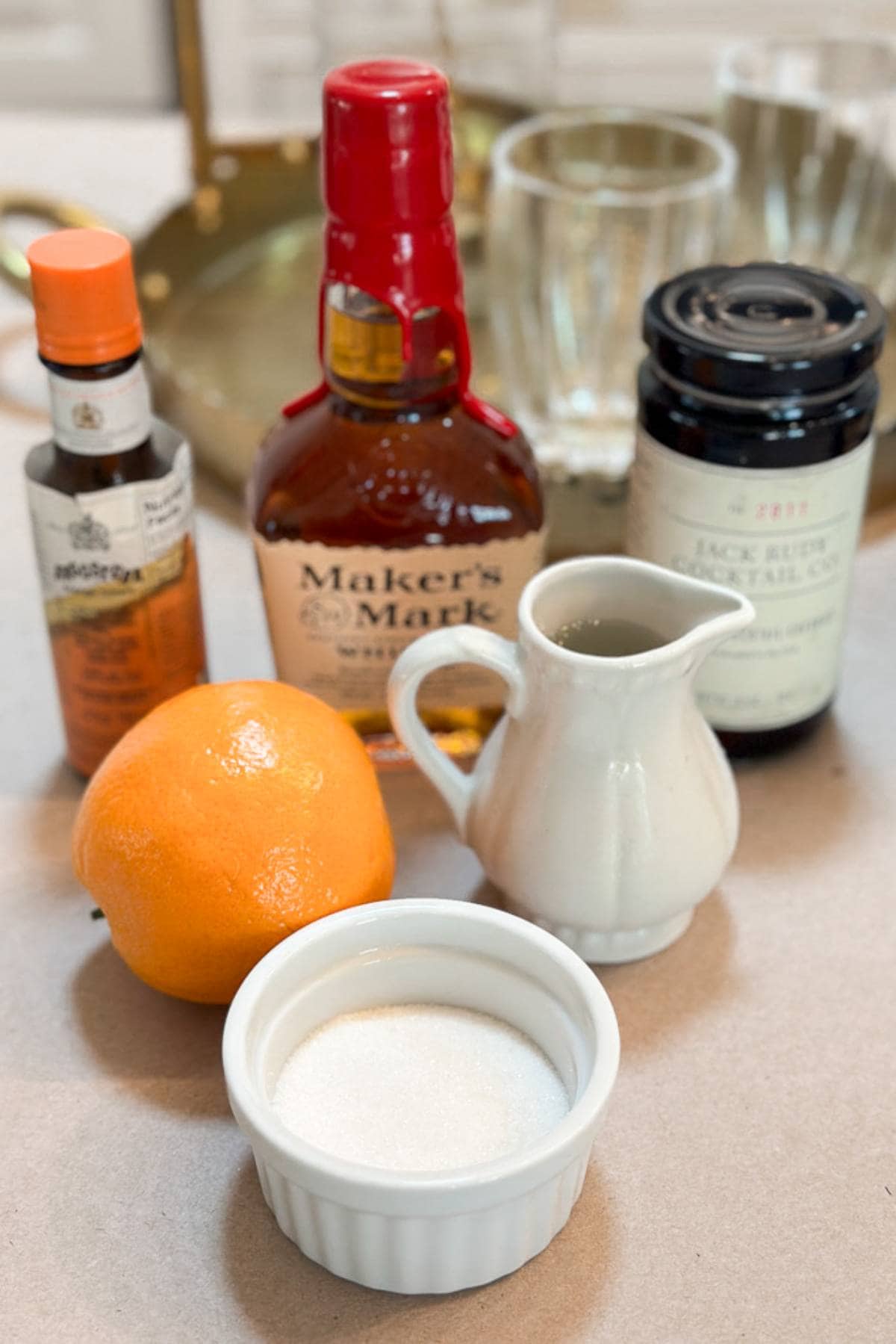 Ingredients to make a smoked Old Fashioned cocktail.