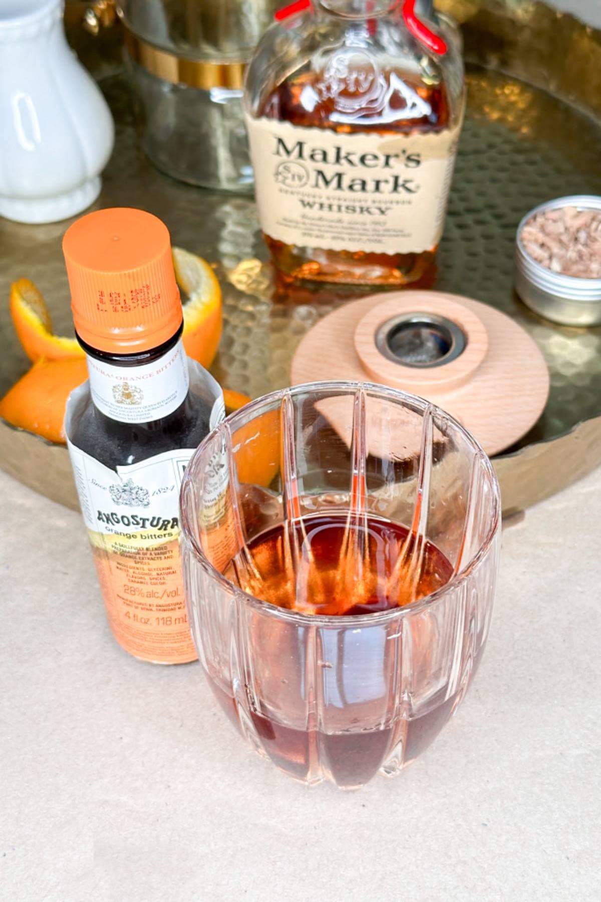 Adding bitters to an old-fashioned cocktail