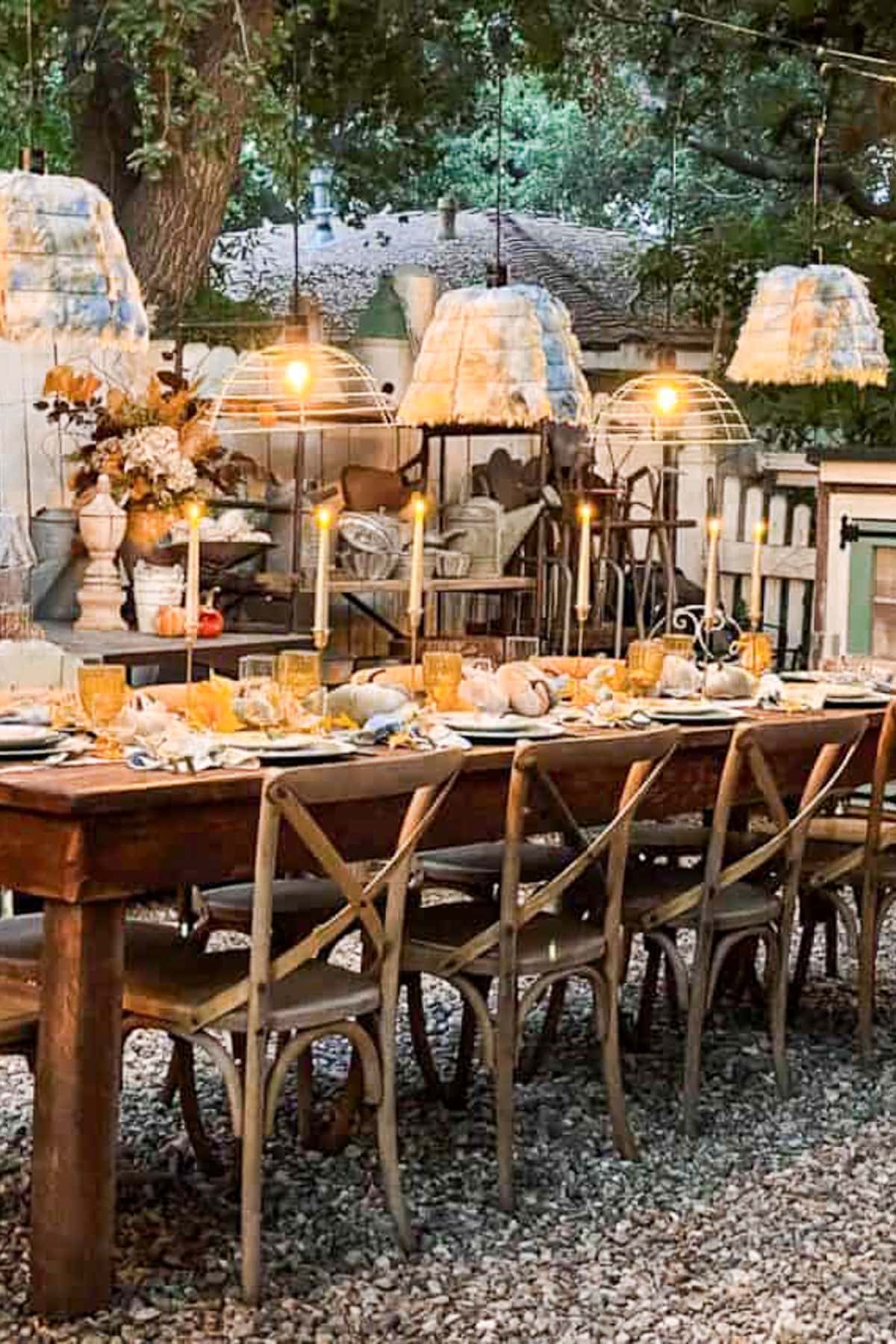 Outdoor tablescape for fall with market lights.