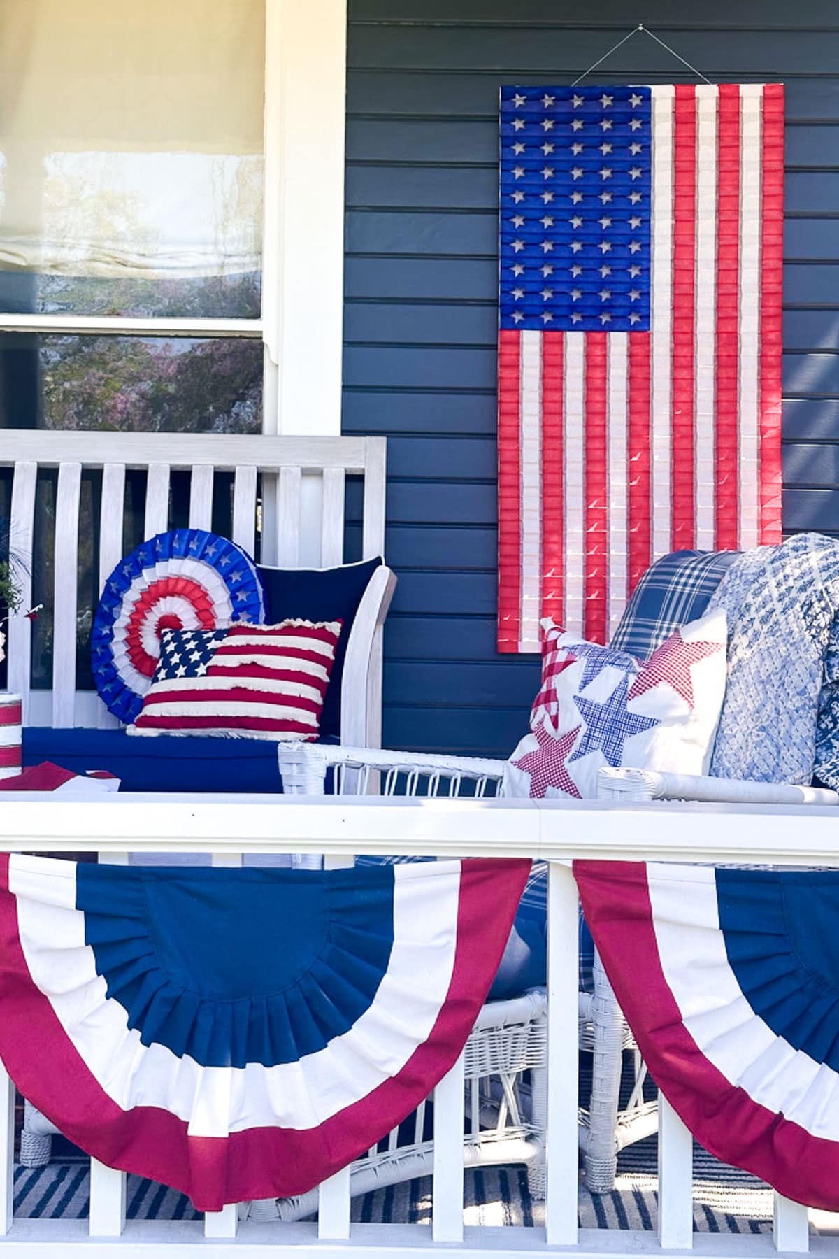 4th of July throw pillows on the front porch furniture 
