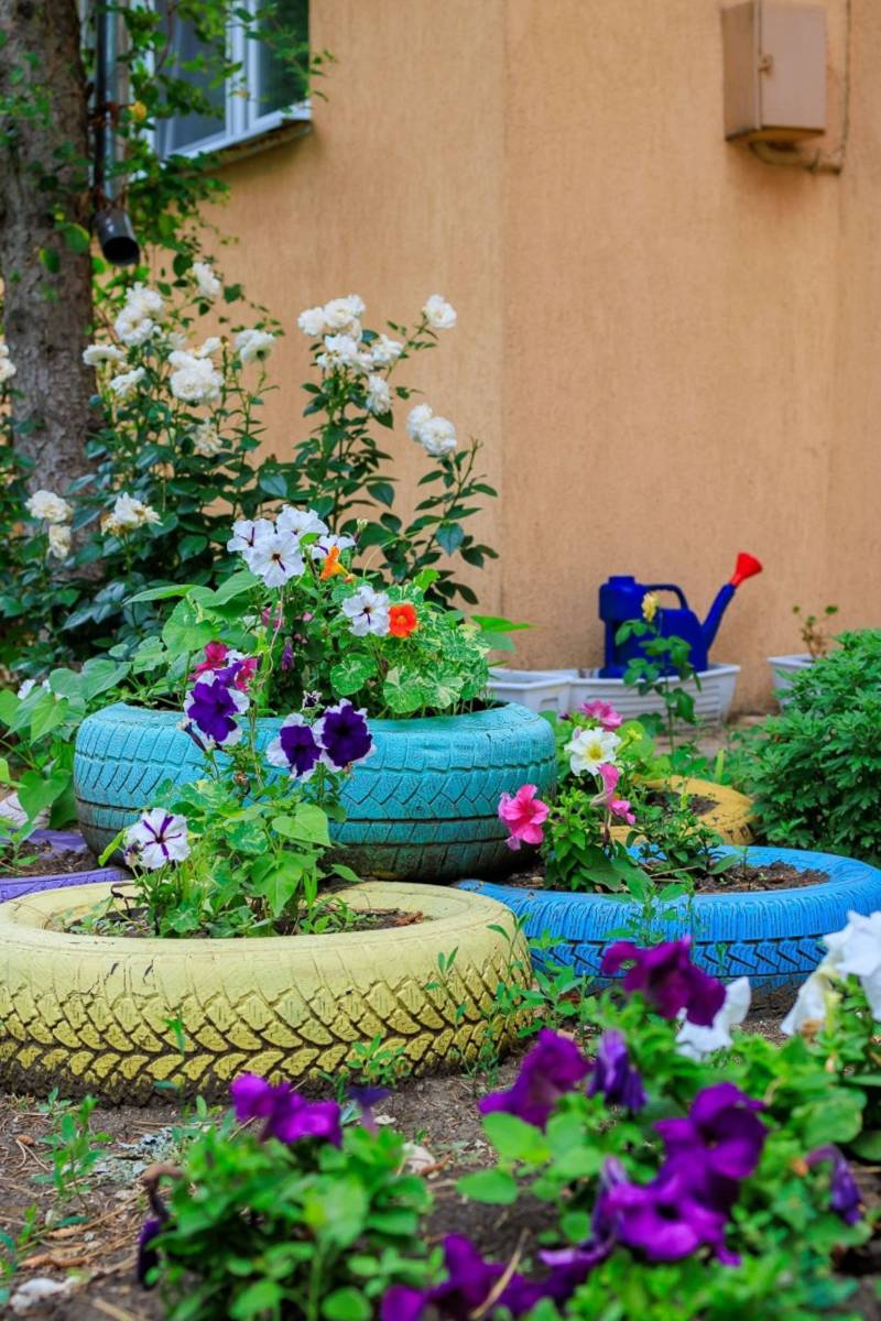 Planted painted tires in the garden.