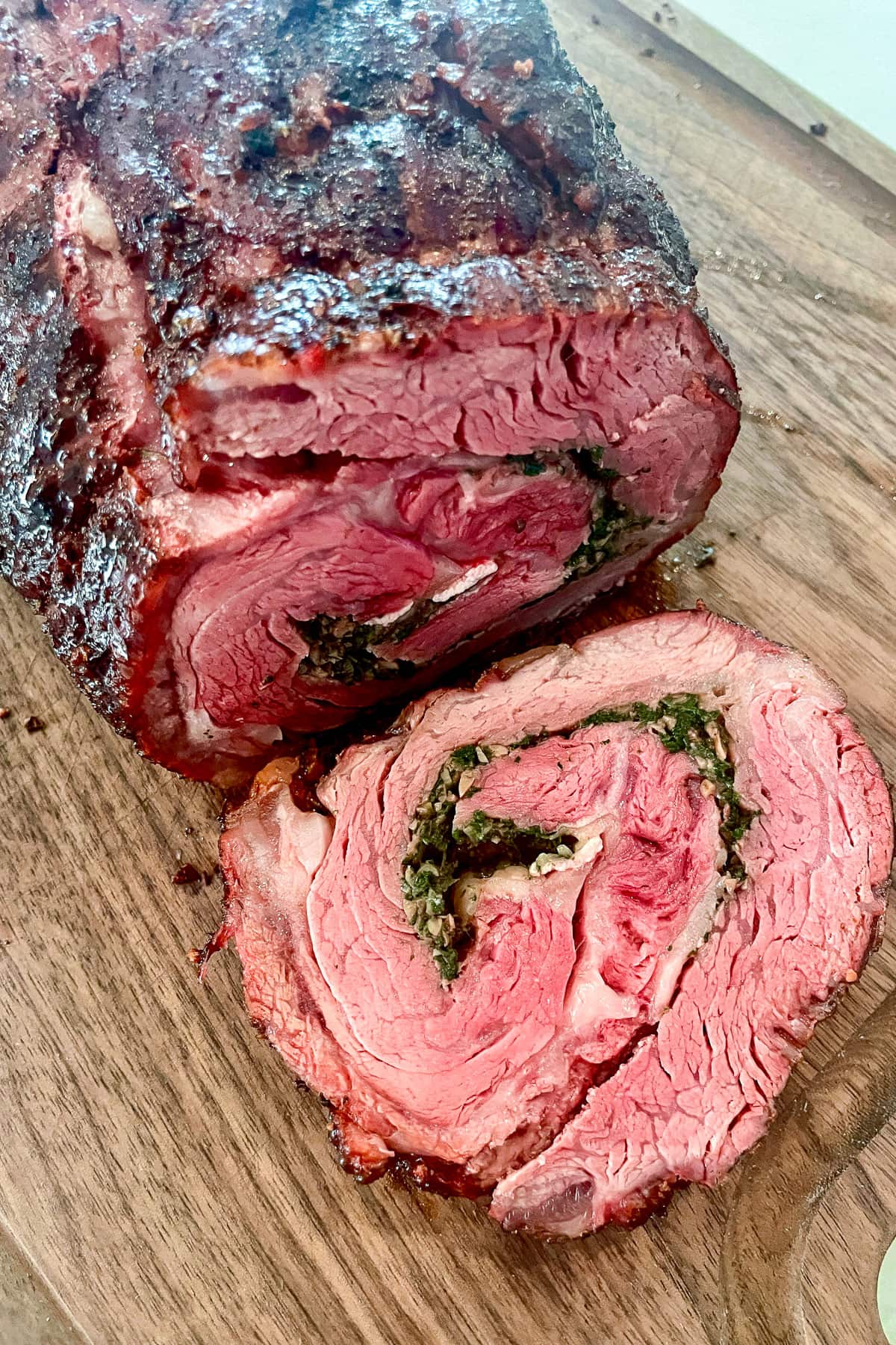 A rollled Spencer steak that is stuffed with spinich and cheese and smoked on the bbq