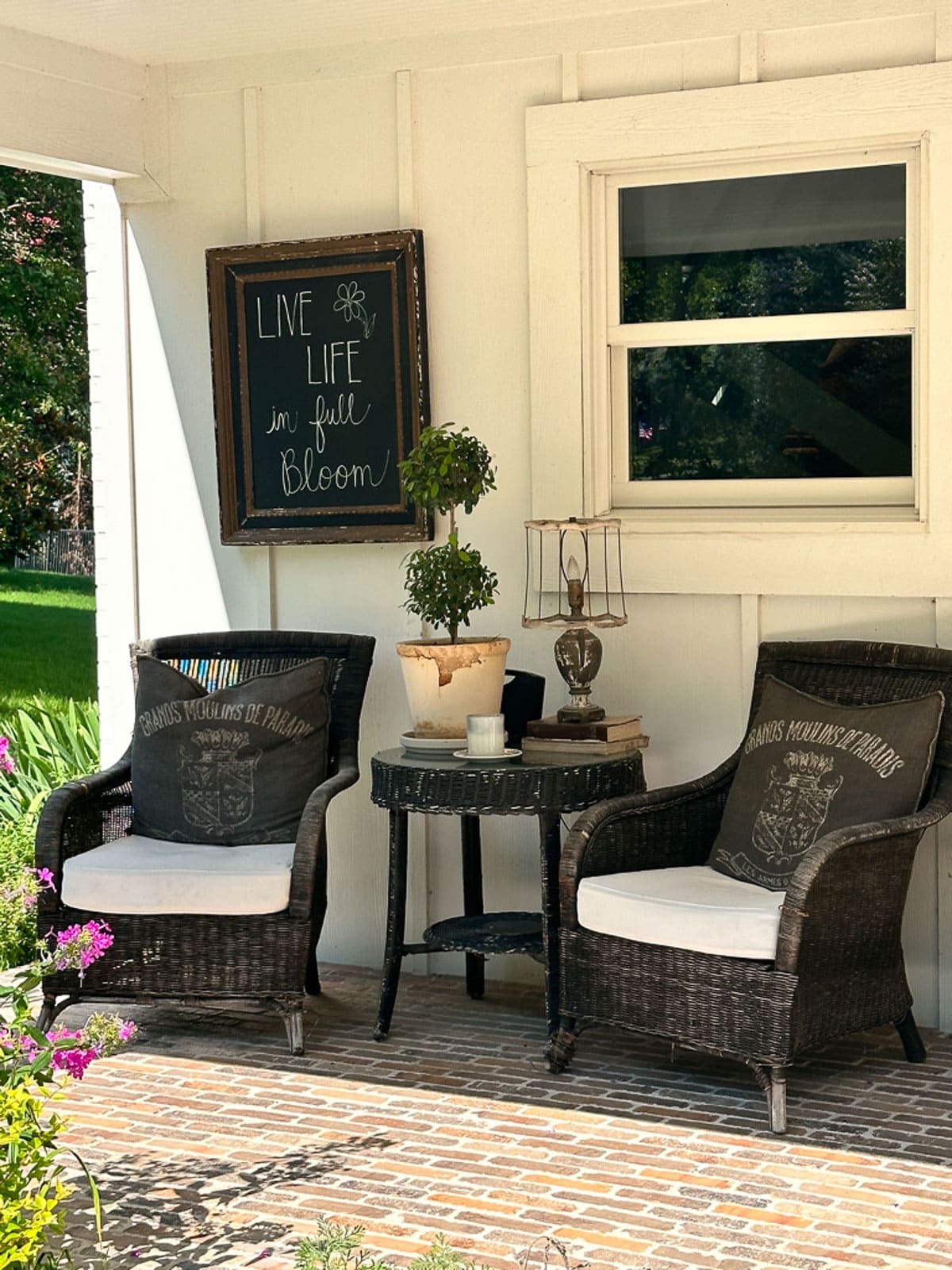 Cozy porch with two chairs and a table. 