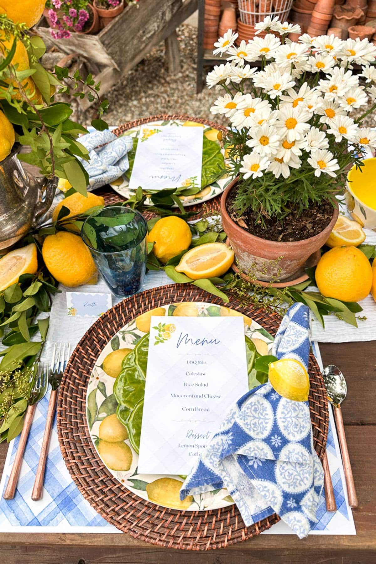 Lemon dishes and lemon themed decor set for an outdoor summer tablescape