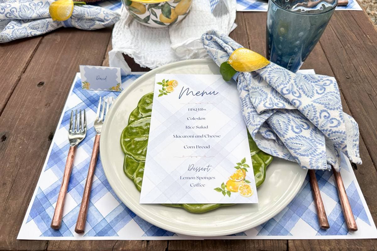 Blue plaid paper placemats with lemons are being used for a summer tablescape.