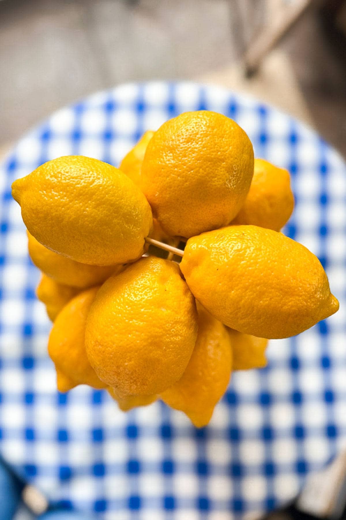 Layers of lemons are put together with skewers to create the shape of a tree for a great lemon centerpiece. 