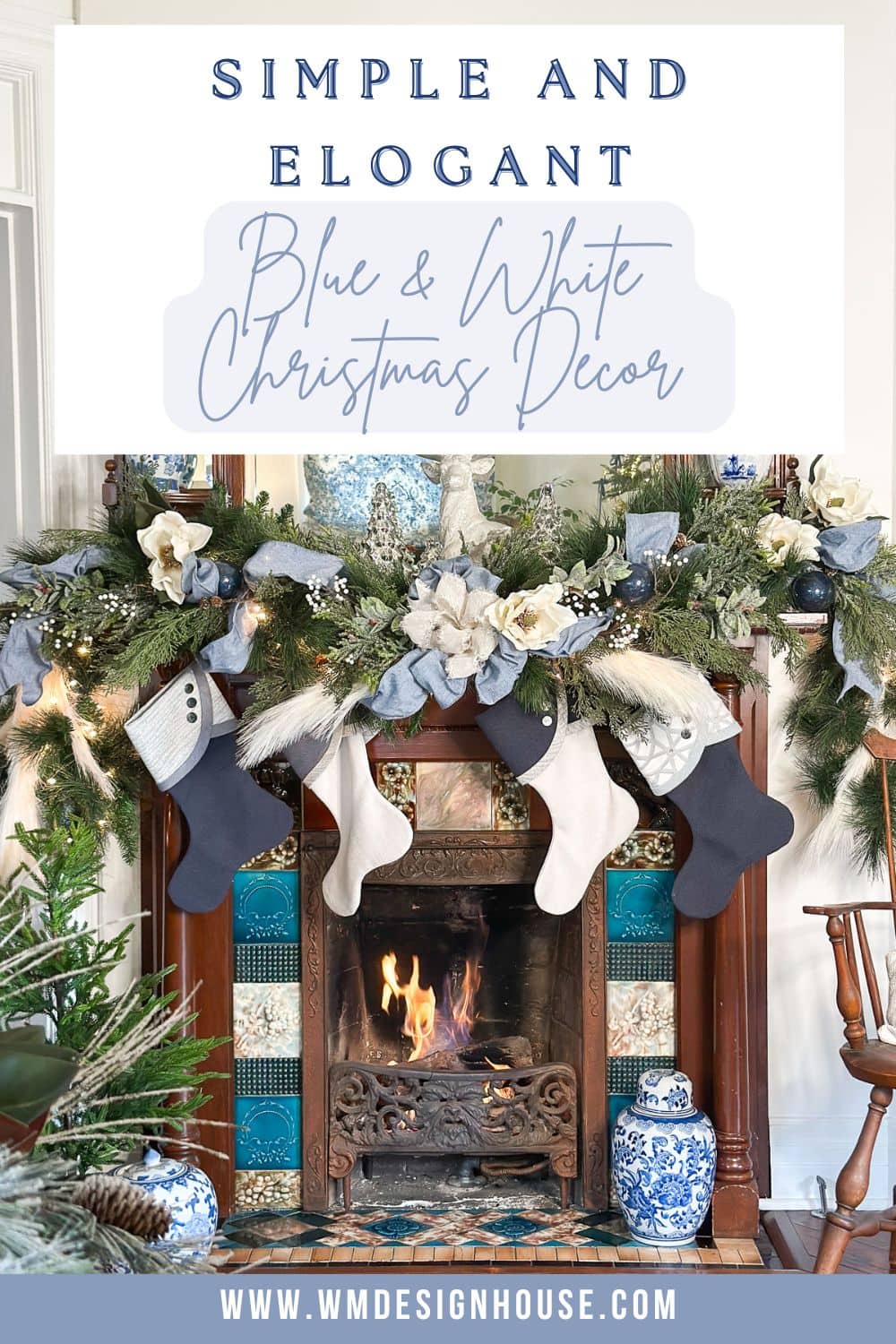 A cozy fireplace decorated with a blue and white Christmas theme. Stockings hang from the mantle, surrounded by lush greenery, pinecones, and white flowers. A sign above reads, "Simple and Elegant Blue & White Christmas Decor.