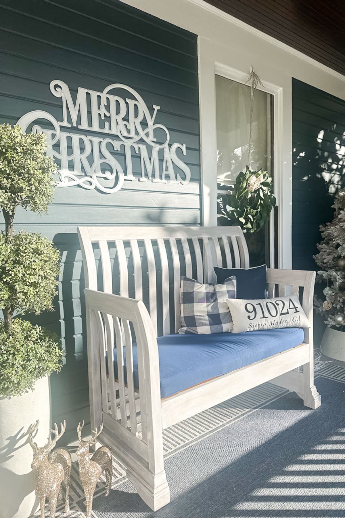 A bench on a porch.
