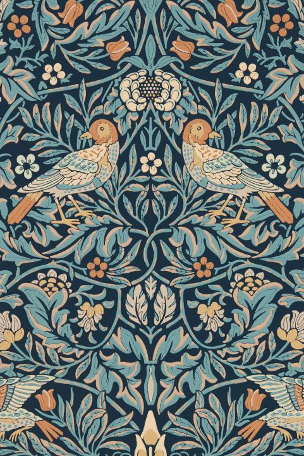 Intricate pattern featuring two birds facing each other amid a symmetrical design of leaves, flowers, and vines in shades of blue, green, orange, and beige on a dark background.