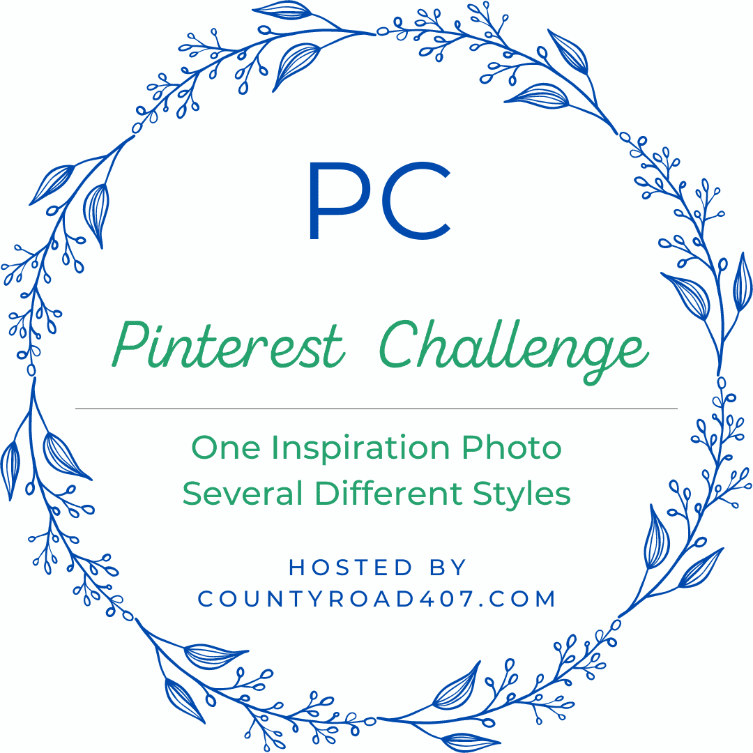 A blue floral wreath frames the text: "PC Pinterest Challenge. One Inspiration Photo, Several Different Styles—perfect for coastal cottage table decor. Hosted by countyroad407.com" on a white background.