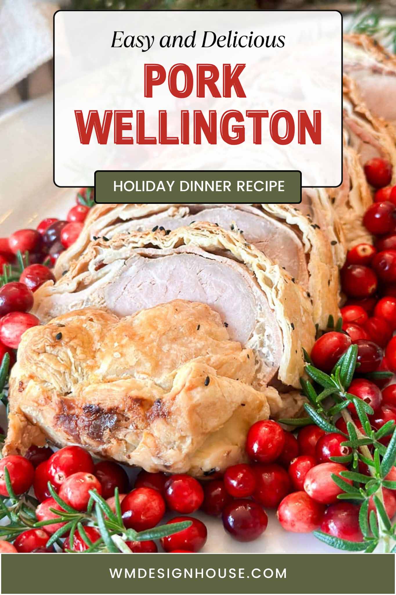 Sliced pork Wellington on a white plate, surrounded by fresh cranberries and rosemary, with text overlay reading "Easy and Delicious Pork Wellington - Holiday Dinner Recipe.