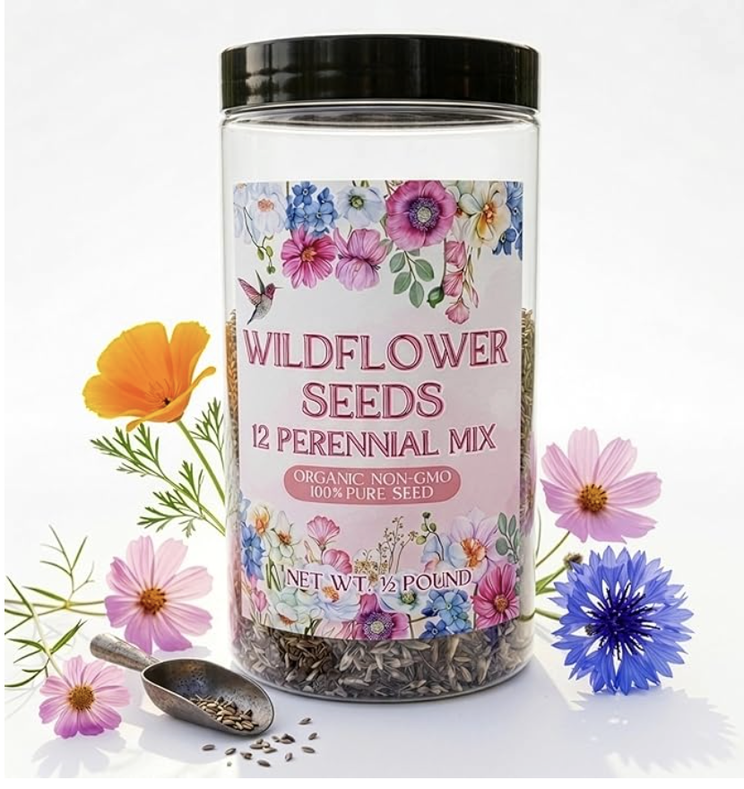 A jar labeled "Wildflower Seeds 12 Perennial Mix" surrounded by colorful wildflowers and a small scoop of seeds—perfect for DIY seed paper or handmade cards. The label features floral illustrations and notes the seeds are organic, non-GMO, and 100% pure.