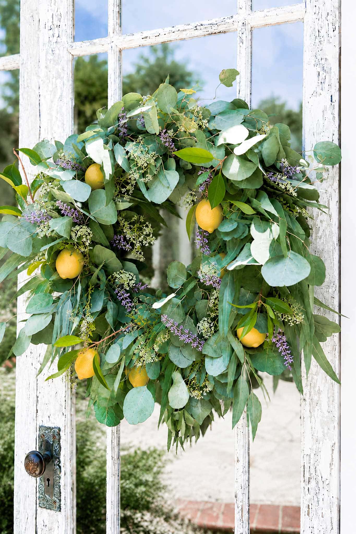 Beautiful green and yellow wreath with eucalyptus and lavender for door decoration.