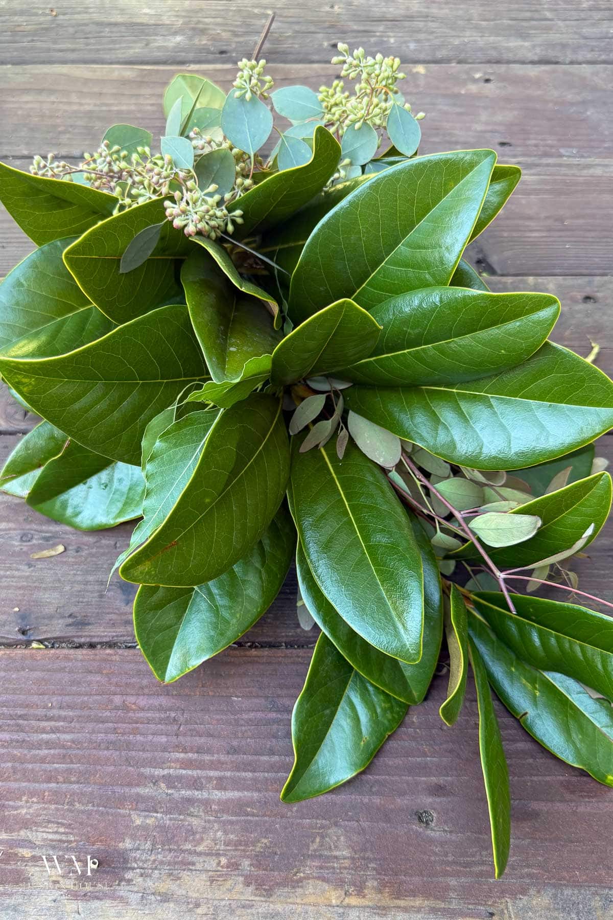 Finished bundle of magnolia leaves and seeded eucalyptus ready to lay on the runner