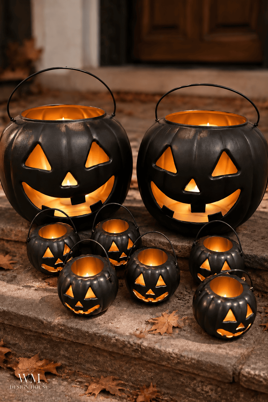 Eight black jack-o’-lanterns with glowing faces sit on stone steps surrounded by autumn leaves, creating a festive Halloween display reminiscent of classic Halloween lanterns and perfect for DIY Halloween décor.